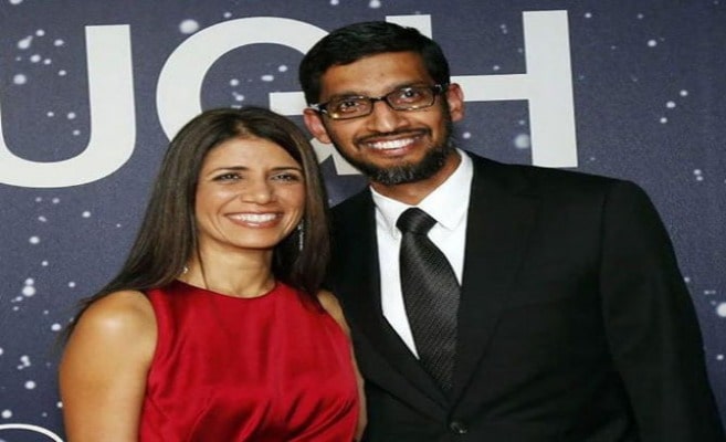 Sundar Pichai wearing a black suit with white shirt and a black tie.